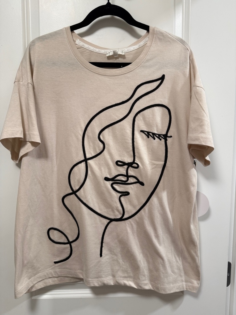 Cream Tee with Black Abstract Face Line Art